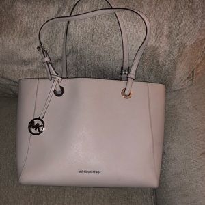 Slate grey Michael Kors purse slightly used. Worn one month.